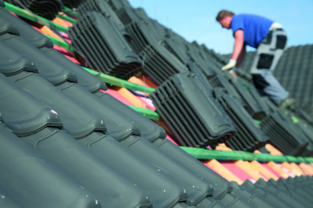 Roofer fixing new slated Ythan Roofing Ellon