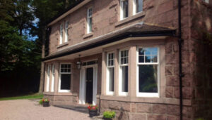 Beautiful house with bay windows, showing new double glazing