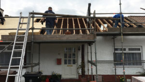 Building with roof removed, starting new roofing job in Aberdeen