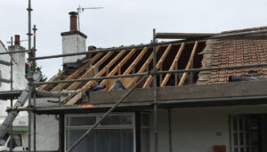 Building with roof removed, starting new roofing job in Aberdeen