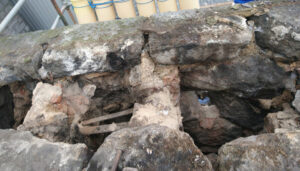 Crumbling granite chimney stack