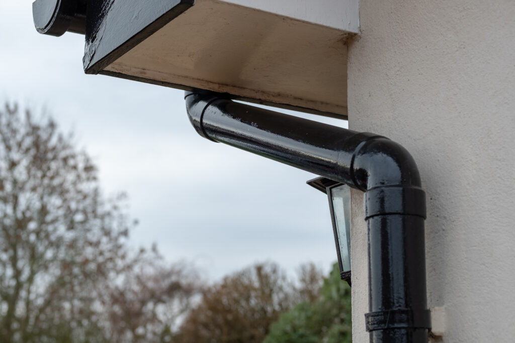 New gutter and downpipes directing rain water from roof, Aberdeen